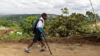 Raphaël walking to Selembao inclusive school in DRC. 